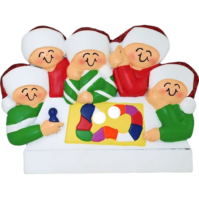 Cheerful holiday ornament showing five smiling people in festive hats gathered around a colorful family game board scene