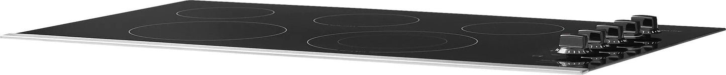 Black electric cooktop with four burners and control knobs on smooth glass surface from kitchen appliances collection