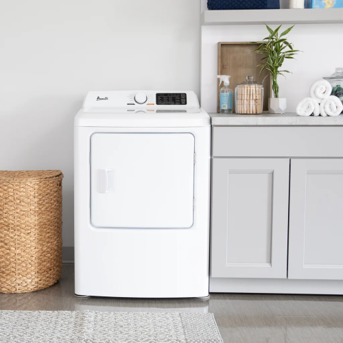 White front load electric clothes dryer with digital controls and dial, placed in a modern laundry room setting