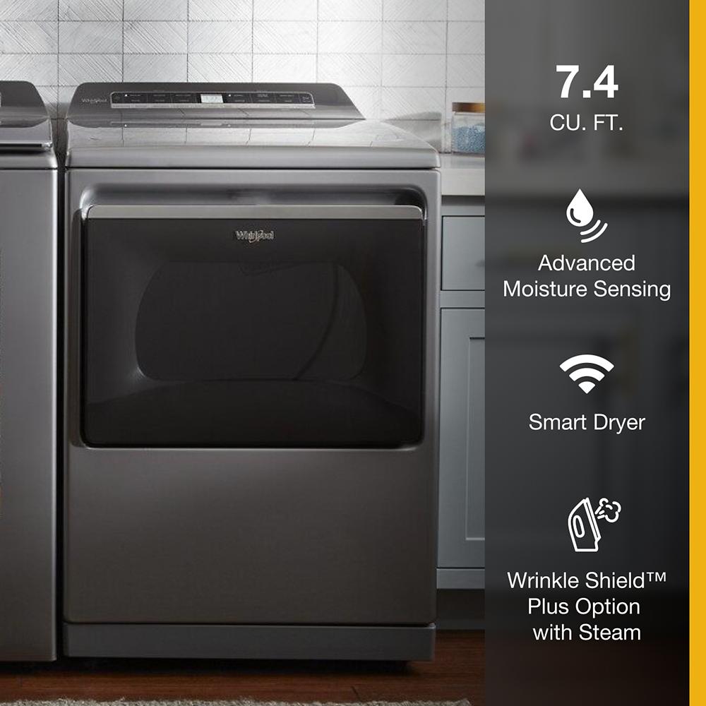 Dark gray smart gas dryer with advanced moisture sensing and wrinkle preventing steam option in modern laundry room setting
