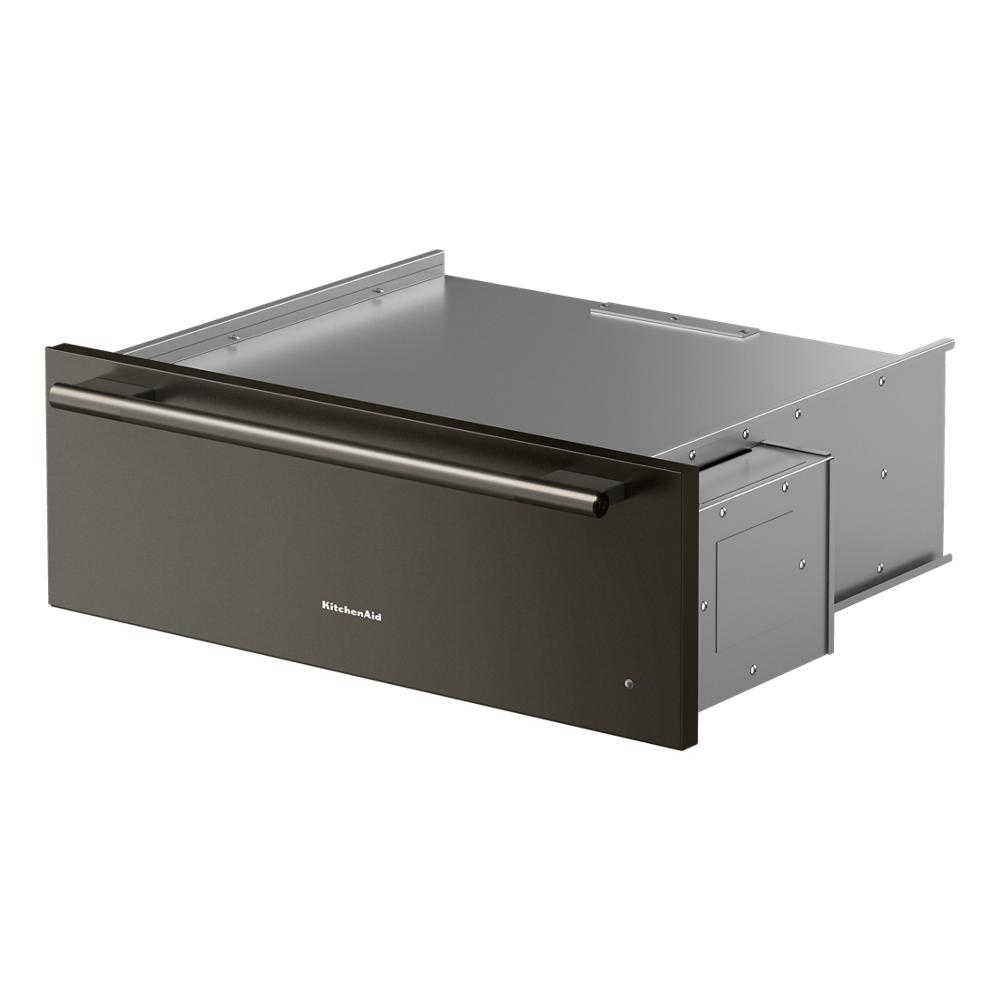 Angled view of a dark stainless steel warming drawer with long horizontal handle from KitchenAid Appliances collection