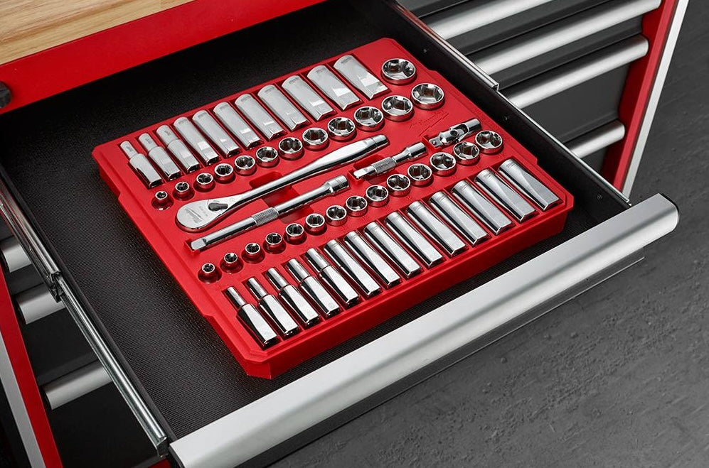 Organized chrome socket and ratchet set in red tray inside black tool drawer for hand and woodworking tools