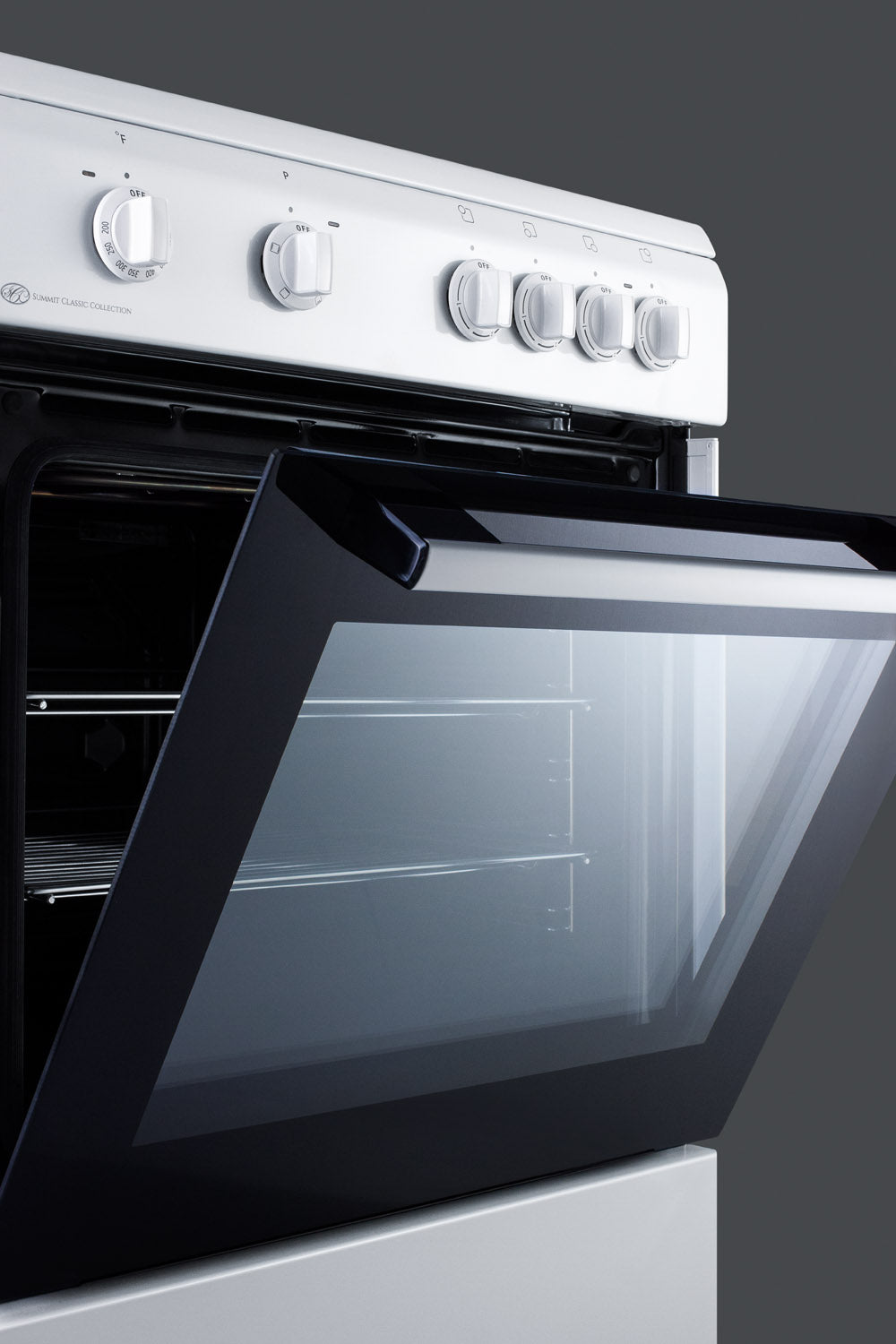 White electric range with open oven door and control knobs from the Summit Classic Collection for modern kitchens