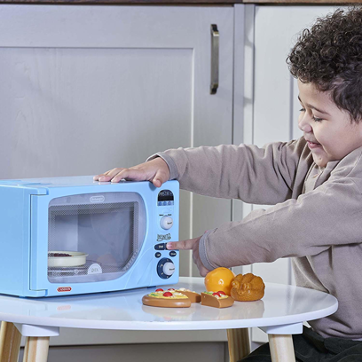 Child playing with blue Casdon De'Longhi Microwave toy in pretend play toys and under $50 collections