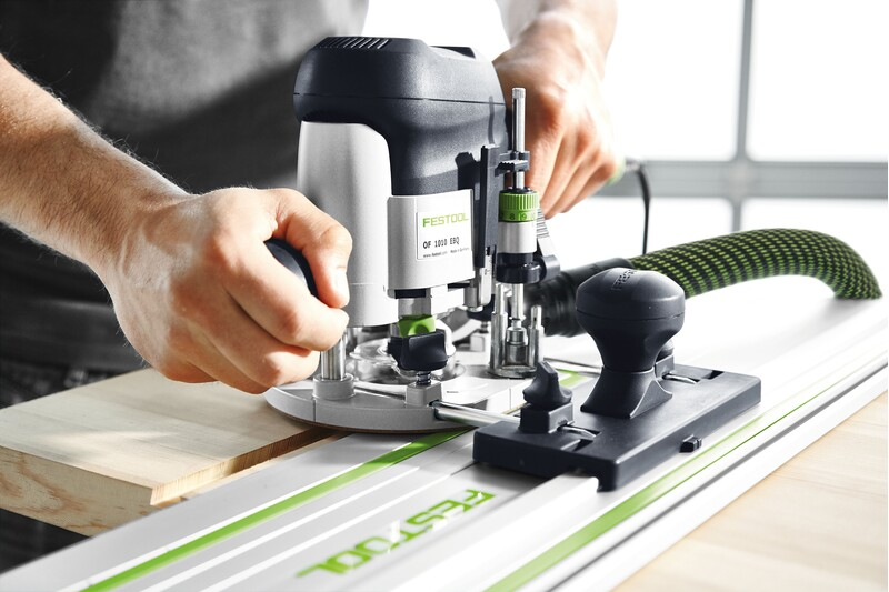 Compact woodworking router with guide stop and ergonomic handles for precise home improvement tasks