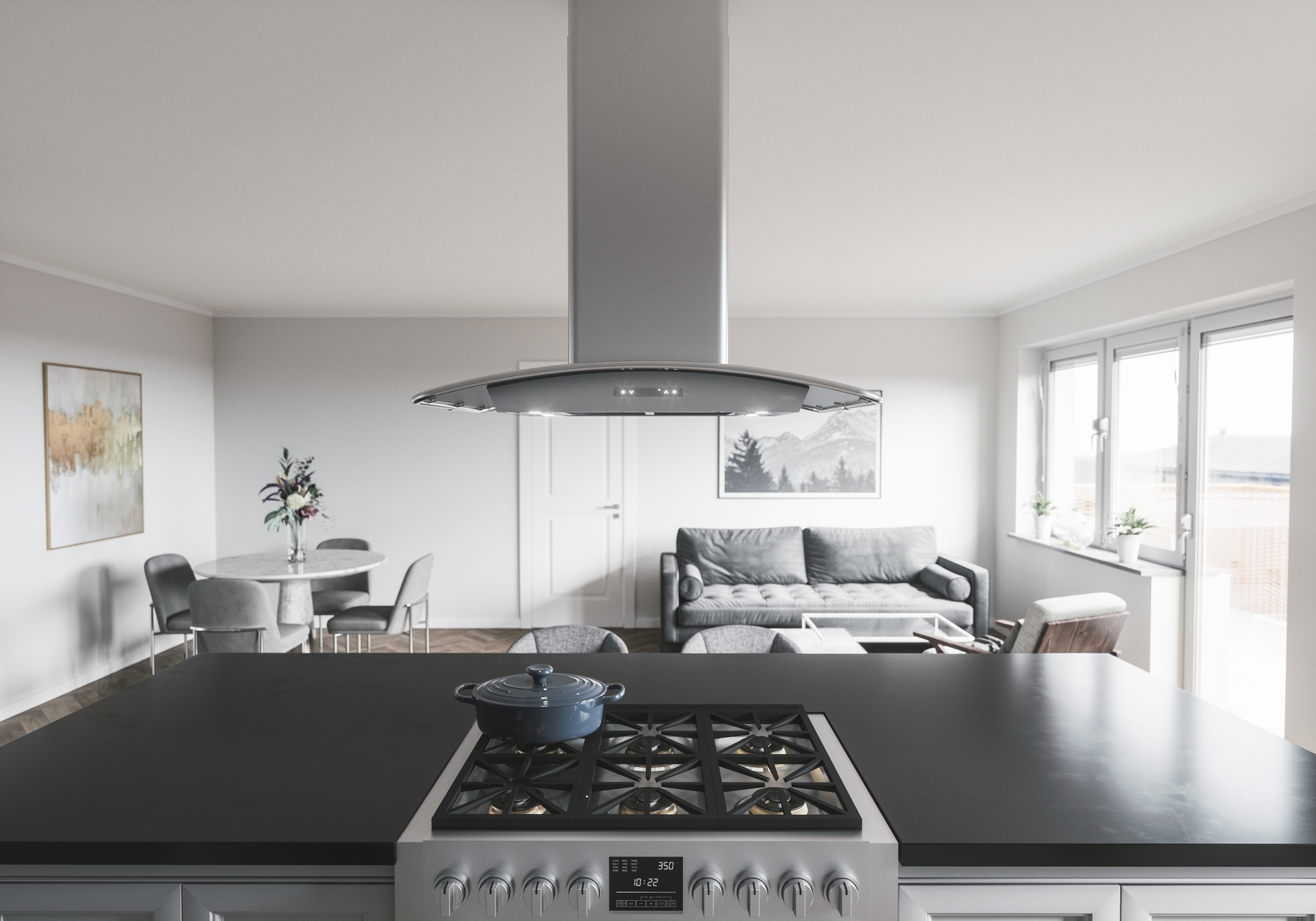Modern kitchen interior featuring a stainless steel island hood above a gas range in a bright, open living space