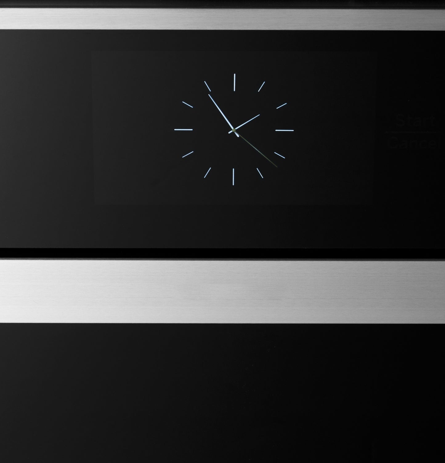 Close-up of sleek digital clock display on stainless steel and black minimalist wall oven from kitchen appliances collection