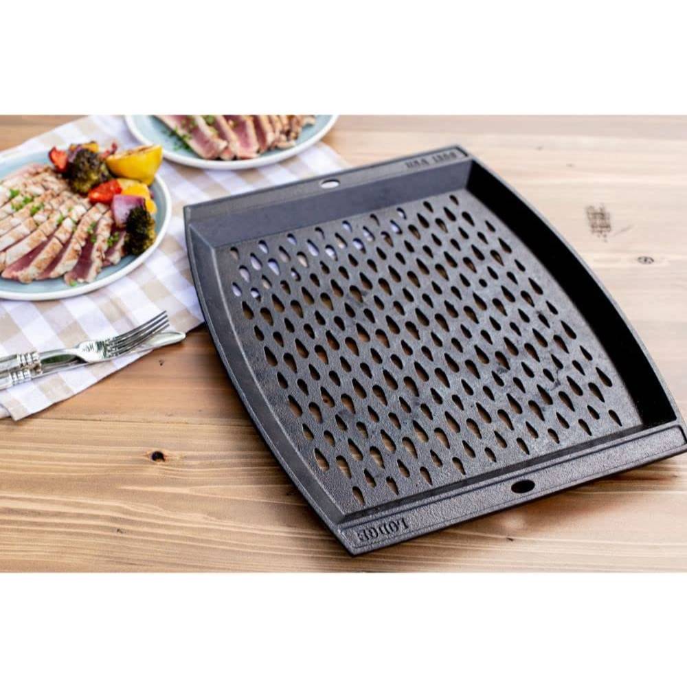 Seasoned cast iron grill topper with oval perforations and curved edges for enhanced heat circulation and grilling quality