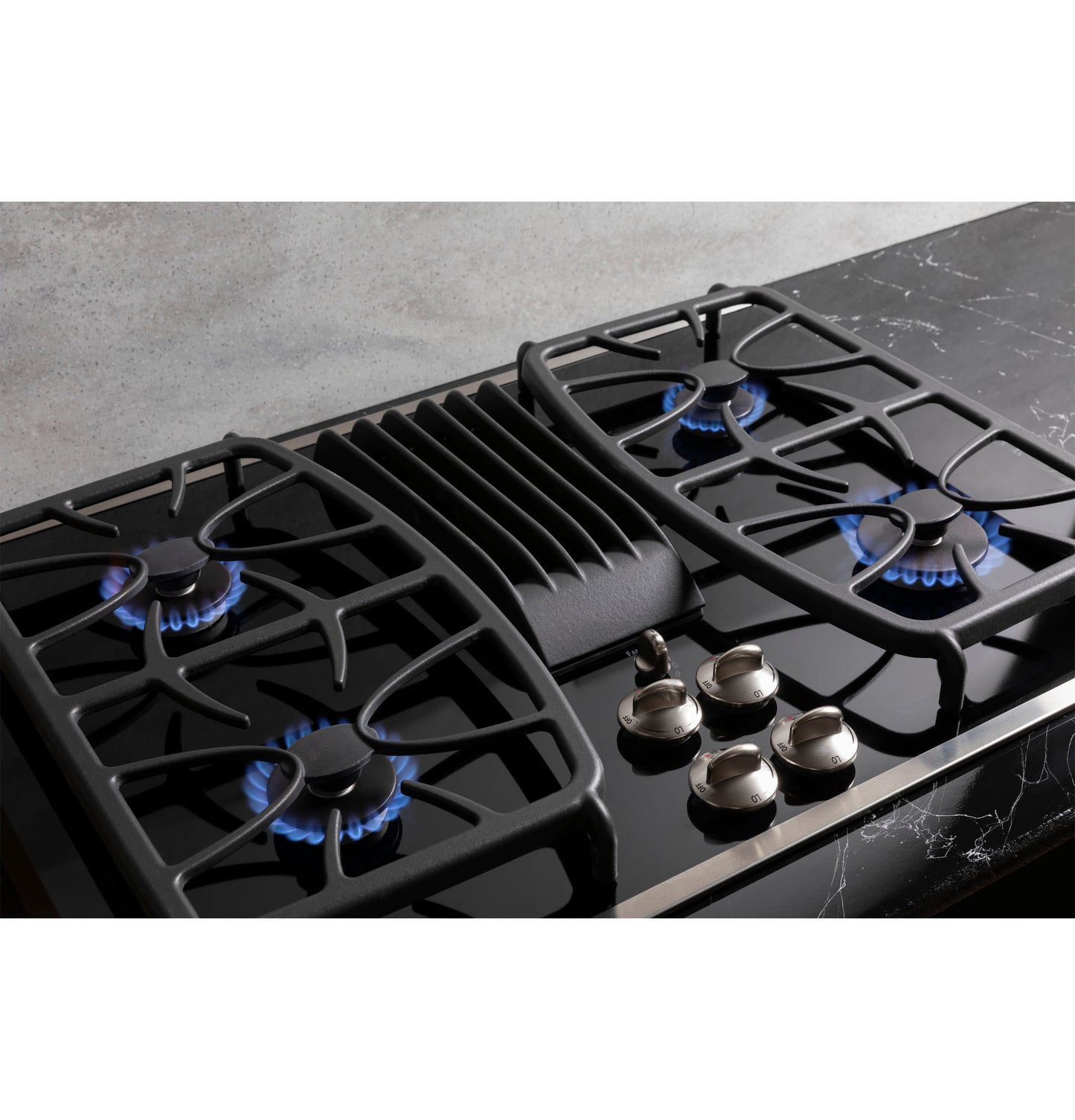 Black 30-inch built-in gas cooktop with four burners and downdraft vent, part of kitchen and cooktops appliance collection