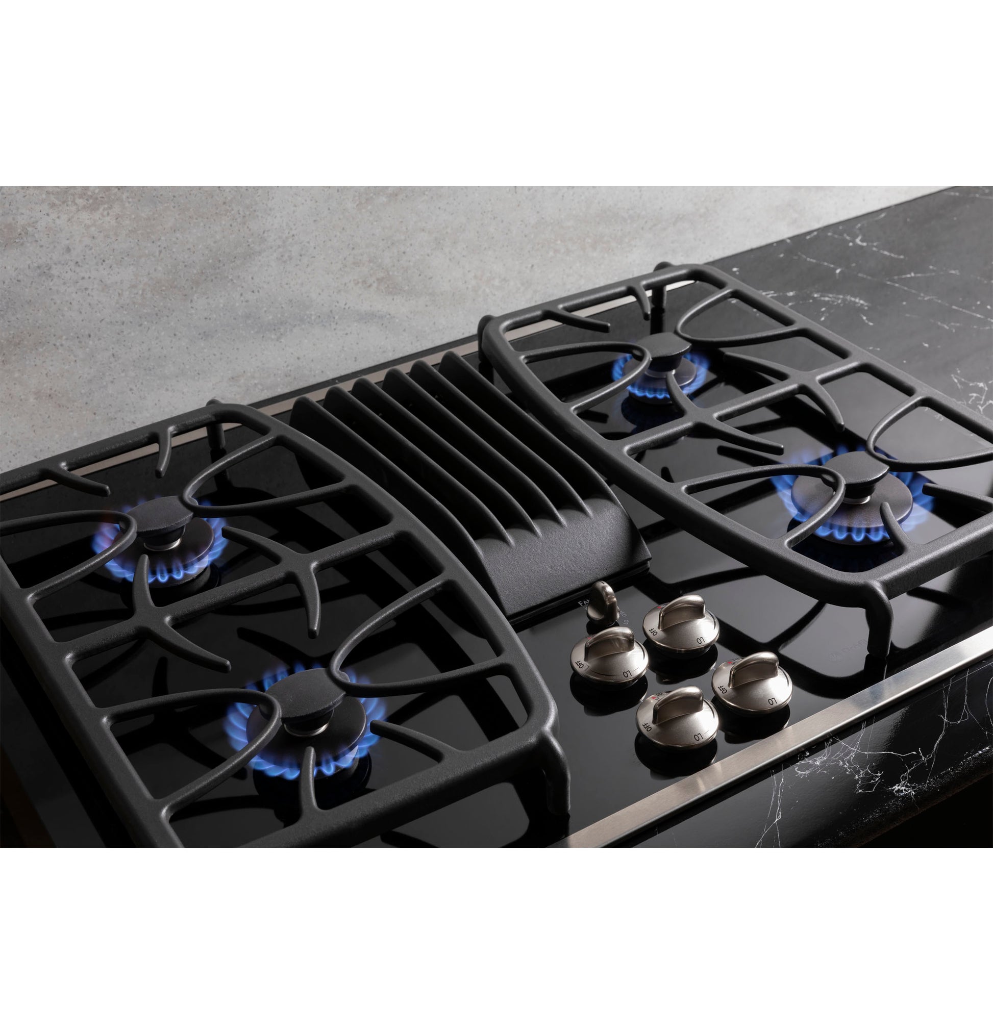 Black 30-inch built-in gas cooktop with four burners and downdraft vent, part of kitchen and cooktops appliance collection