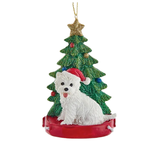 Festive ornament featuring a white Westie with Santa hat sitting by decorated Christmas tree for holiday décor.