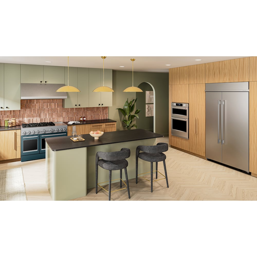 Modern kitchen with 48-inch dual fuel range featuring six burners and griddle, set in green and wood cabinetry interior