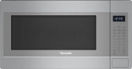 Modern stainless steel built-in microwave with digital control panel and left side door, part of Thermador kitchen appliances.