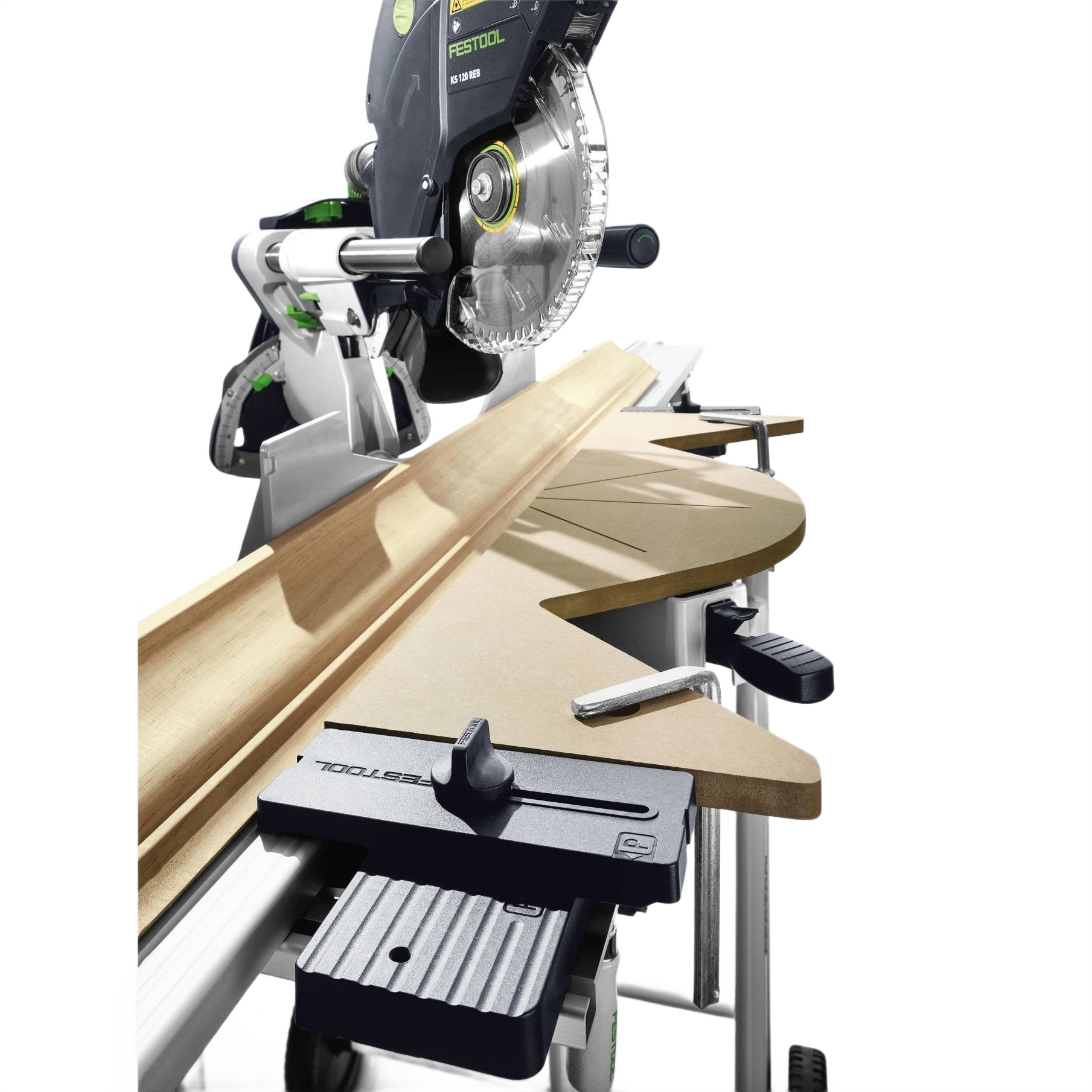 Contoured Festool Kapex crown support board holding molding steady on a miter saw in tool accessory setup