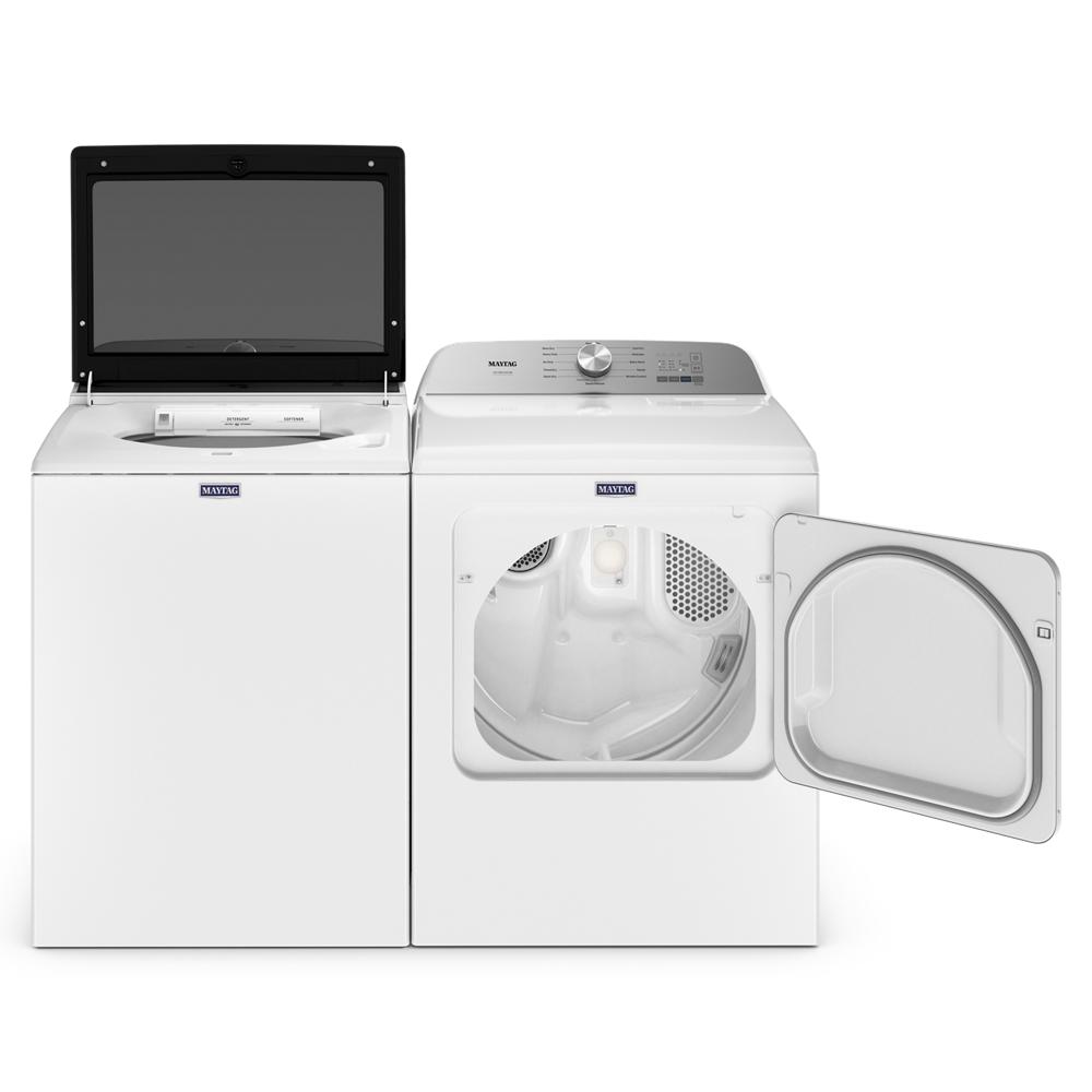 White top load washer with open lid beside front load dryer with door open in modern laundry appliance set