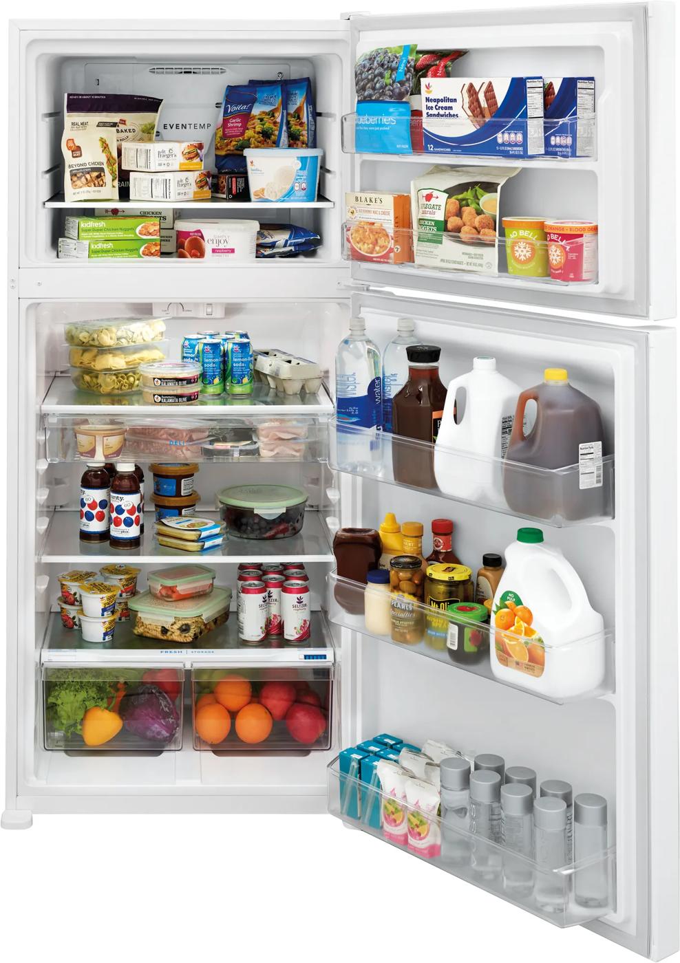 Open white top freezer refrigerator with adjustable shelves stocked with beverages, dairy, and fresh produce in appliances collection