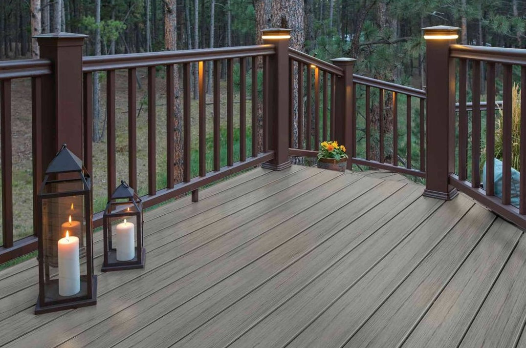 Outdoor deck with composite railing and warm lighting, showcasing quality lumber and decking materials collection.