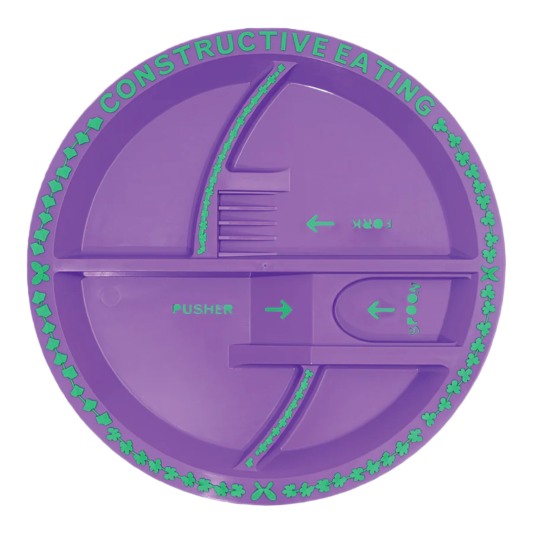 Purple divided plate with labeled sections for fork, spoon, and pusher, designed for guided eating assistance