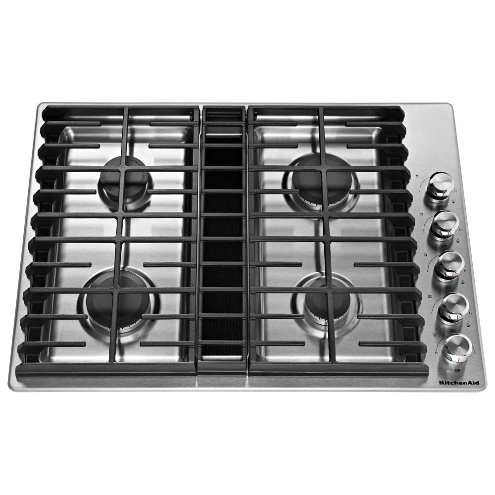 Stainless steel 4-burner gas cooktop with integrated downdraft vent and front control knobs in kitchen appliances collection