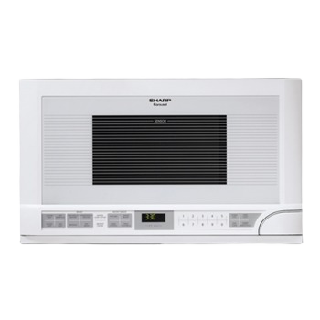 White countertop microwave with sensor cooking technology and digital control panel in kitchen appliances collection