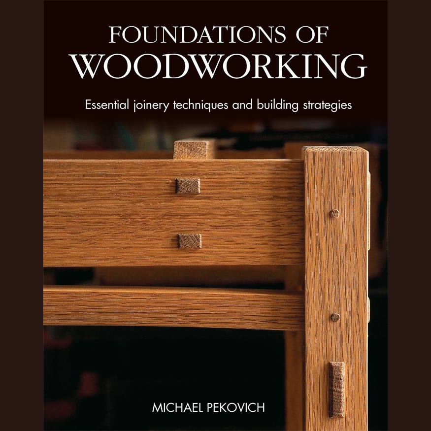 Close-up of wooden joinery details on a chair highlighting craftsmanship and woodworking techniques in home improvement.