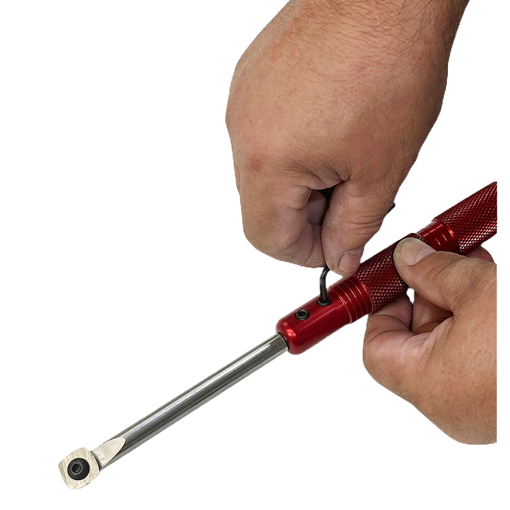 Hands adjusting red micro pen turning tool with steel tip in woodworking tools collection under $100