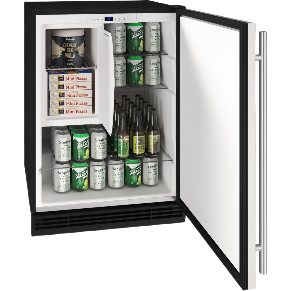 Open 24-inch fridge freezer combo with reversible hinge, white interior, stocked with beverages and frozen snacks in appliances collection