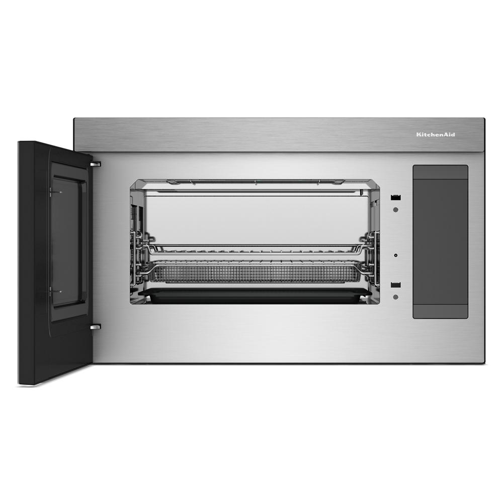 Open stainless steel multifunction over-the-range oven with flush built-in design showing interior air fryer basket and racks