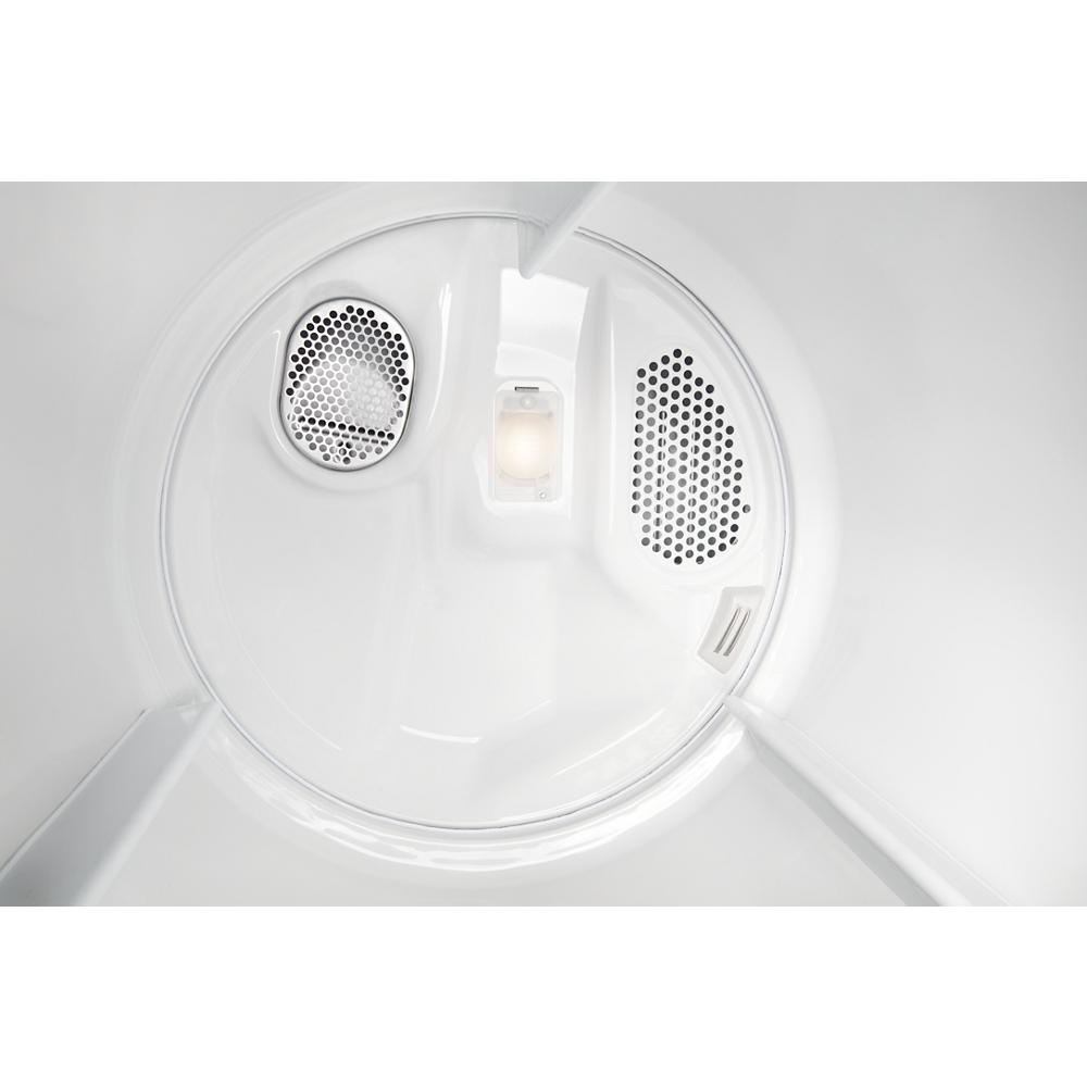 Interior drum of a white dryer showing vent holes and interior light from the Dryers collection in appliances.