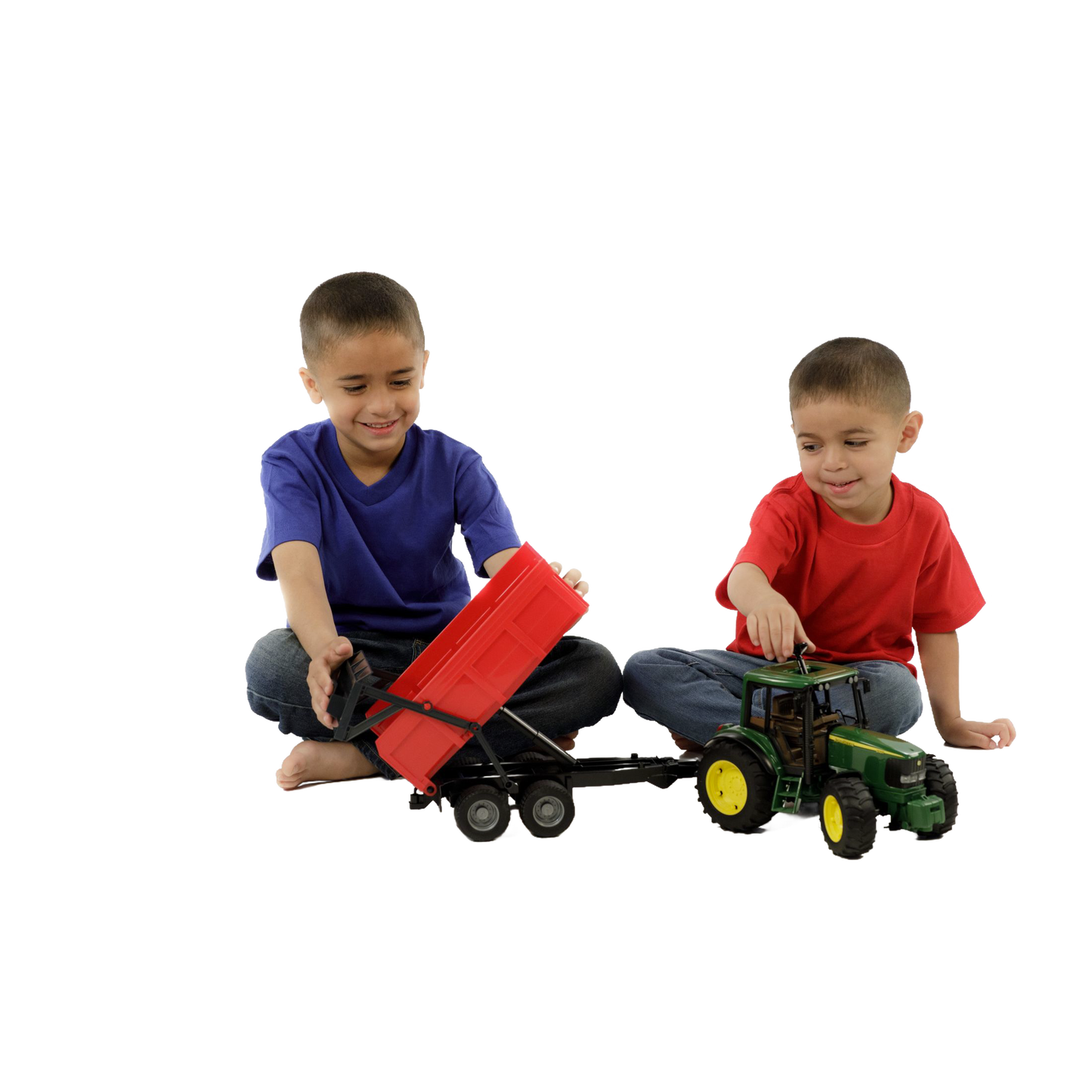 Two boys playing with a green and yellow toy tractor and red tipping trailer from Bruder Toys collection