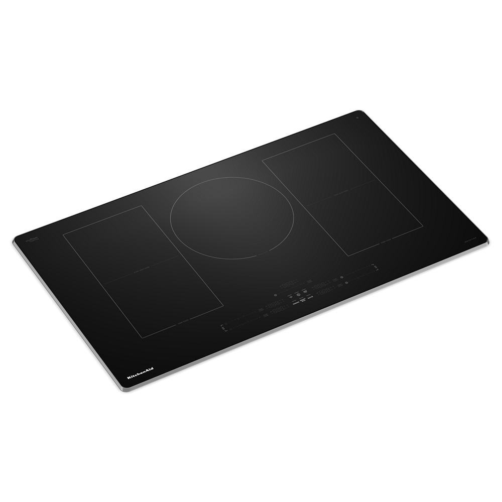 Black glass induction cooktop with five cooking zones and touch controls from KitchenAid cooktops collection