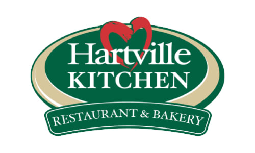 Oval green and beige logo with the words Hartville Kitchen in white text and a red heart design above, featuring a banner reading Restaurant & Bakery.