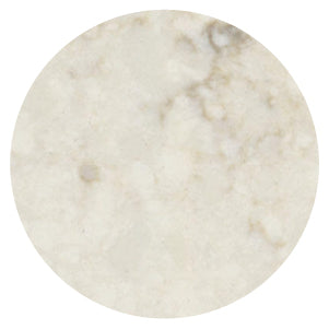 Round sample showing a soft beige stone surface with gentle mottled patterns and a smooth matte finish.