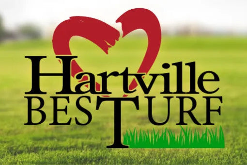 Stylized logo with the words Hartville Best Turf over a vibrant green lawn background featuring a red heart shape above the text.