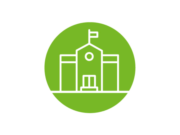 Simple white line drawing of a school building with a flag on top inside a solid green circle background