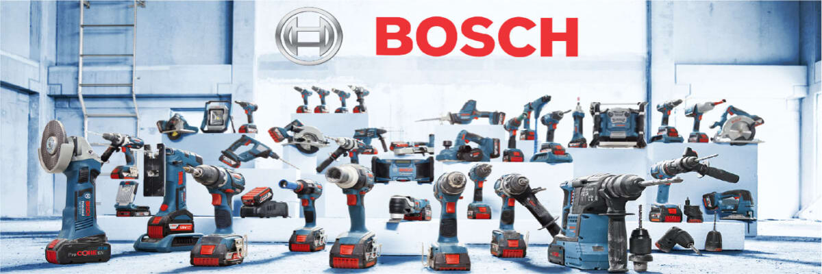 Wide array of Bosch power tools displayed in a bright industrial workshop, showcasing drills, saws, and other equipment under the Bosch logo.