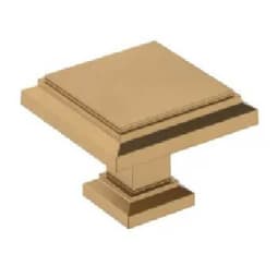 Square cabinet knob with a raised center and beveled edges in a brushed brass finish suitable for home improvement hardware projects.