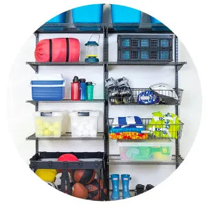 Organized black metal shelving unit holding bins, sports equipment, water bottles, and storage containers against a white wall background.