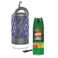 Portable electric mosquito trap with a purple casing next to a green spray can of insect repellent labeled for outdoor use.