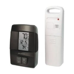 Digital indoor thermometer with black casing displaying temperature and humidity readings next to a white remote sensor device with handle and indicator light.