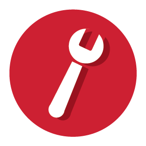 White wrench icon with a shadow effect centered on a solid red circular background representing hand tools for home improvement.