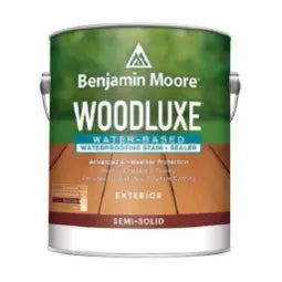 Can of Benjamin Moore Woodluxe semi-solid water-based exterior wood stain and sealer with green and brown labeling designed for home improvement and wood protection.