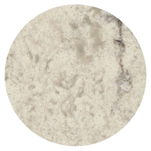 Close-up view of a light beige stone surface with soft gray and subtle brown mottling, featuring a smooth, natural texture.