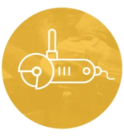 White line drawing of an angle grinder with a circular blade on a warm golden circular background featuring faint construction and tool-related textures.