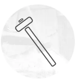 Simple black line drawing of a hammer with a straight handle, set against a soft circular background with faint tool textures.