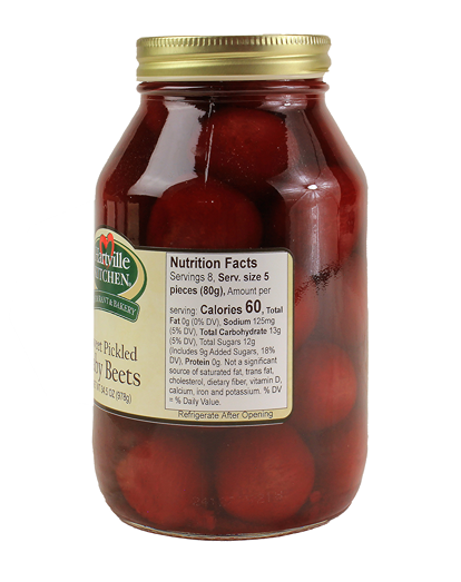Glass jar filled with tender sweet baby pickled beets from Hartville Kitchen Preserved Goods collection