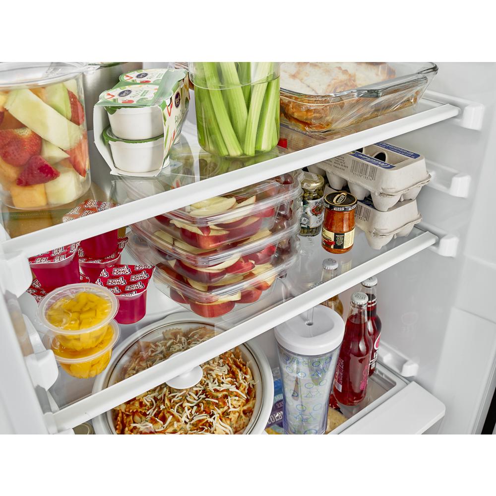Interior view of an 18 cu. ft. white refrigerator with neatly organized food containers in Refrigerators and Appliances collections