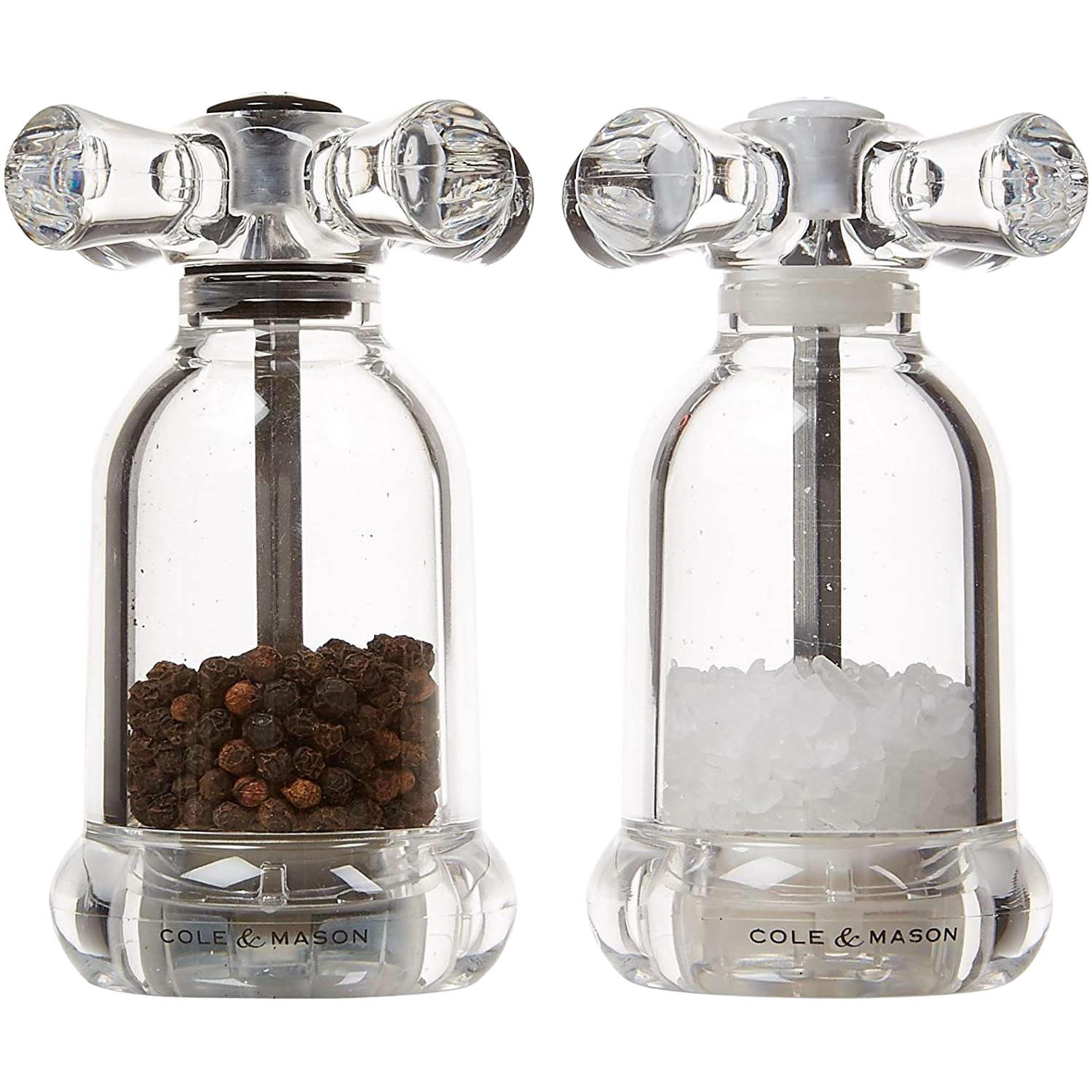 Clear acrylic salt and pepper mills filled with black peppercorns and coarse salt in Kitchenware collection
