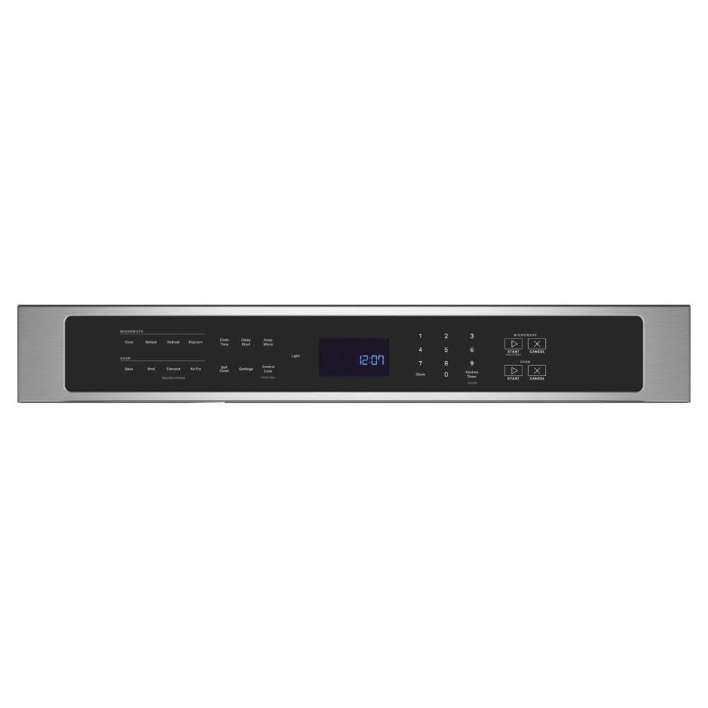 Stainless steel control panel with digital clock, touch controls, and cooking presets for a wall oven microwave combo