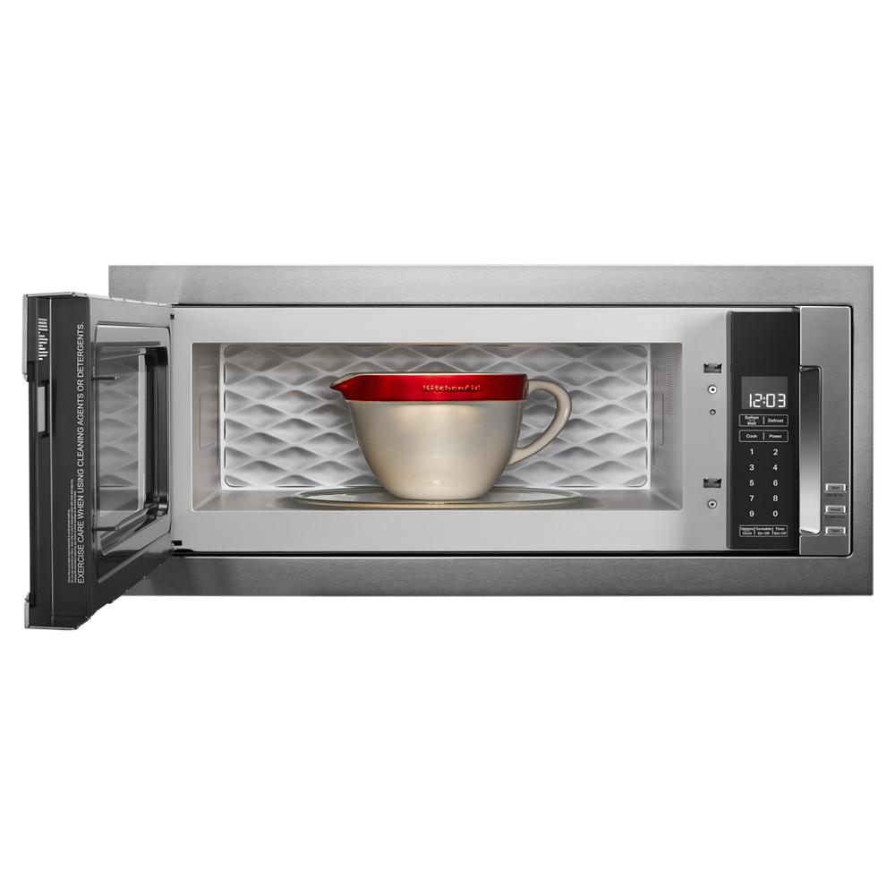 Built-in microwave with open door, digital control panel, and mixing bowl with red lid inside kitchen appliances collection